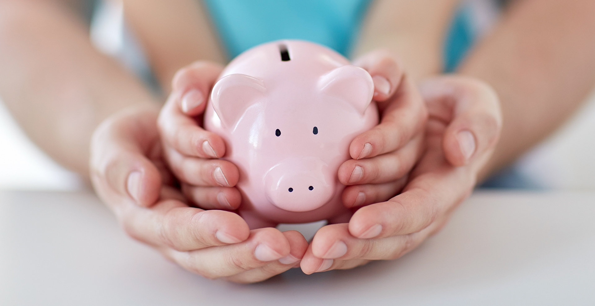 family holding piggy bank